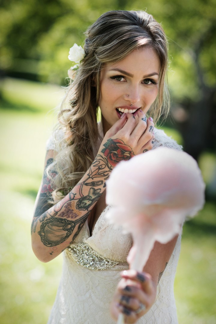Bride eating cotton candy Love in the Summer Bridesmaids by Funkytown Photography West Coast Weddings