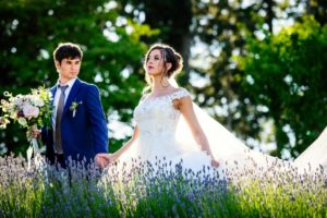 Couple walking in field of lavender Kristen Borelli Photography