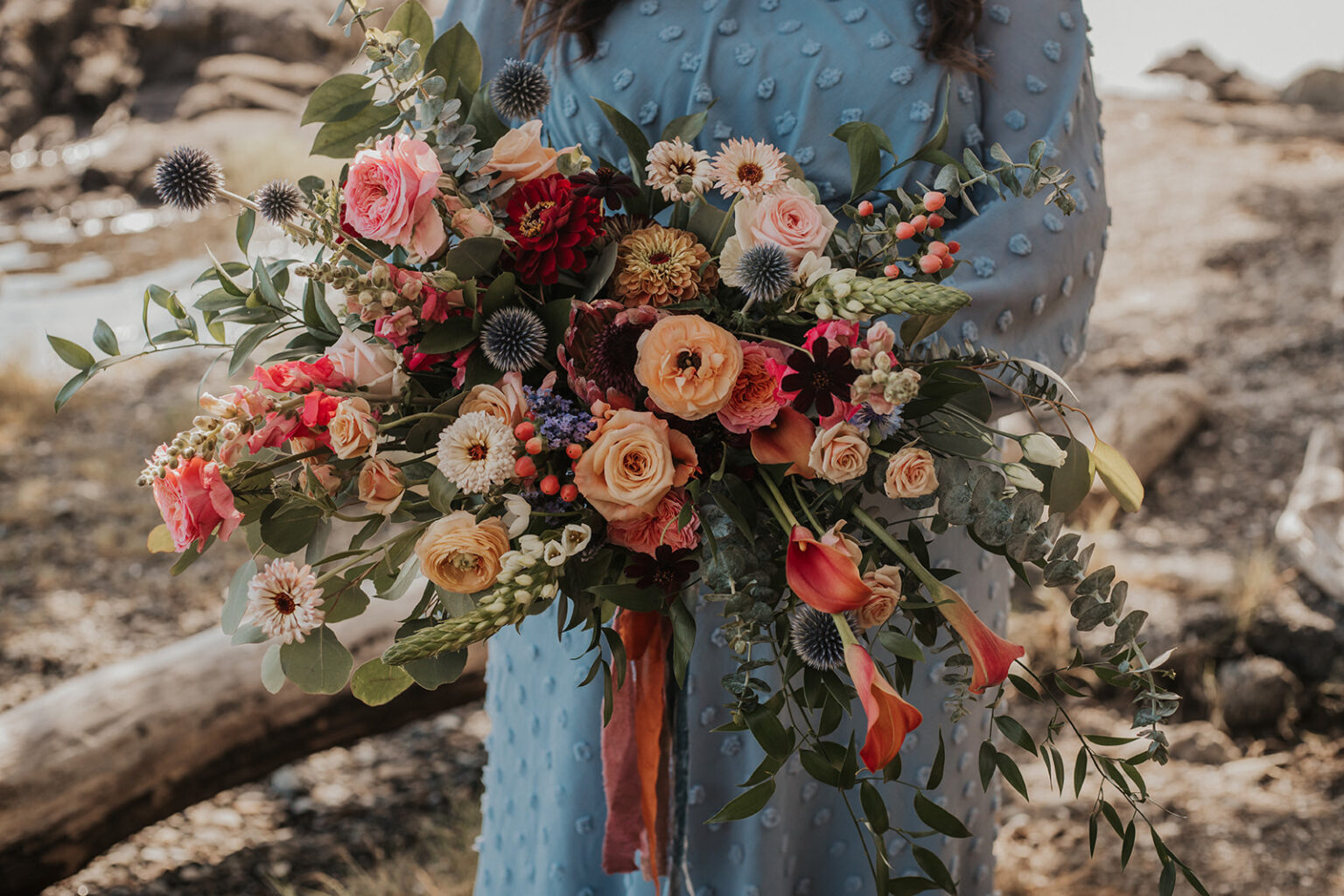 bride in forest with large bouquet of ferns, roses and peony by West Coast Floral Design