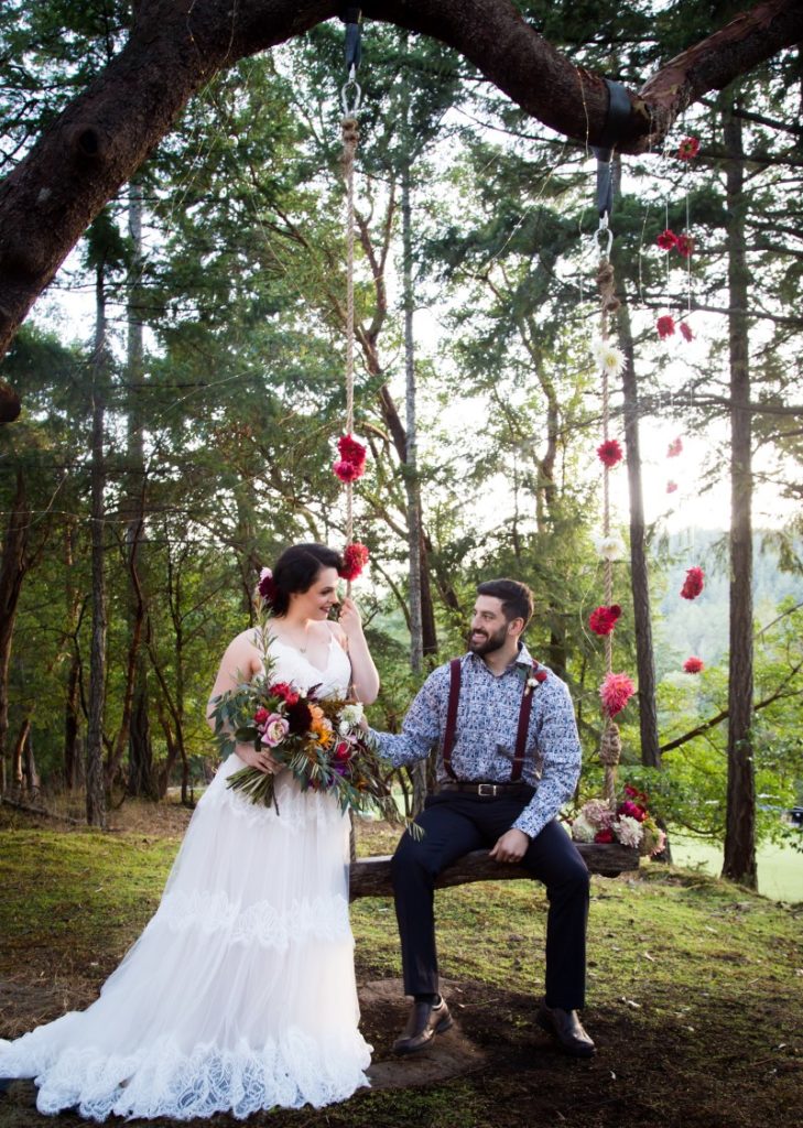 Spanish Style Newlyweds on Tree Swing Olympic View Golf Course Vancouver Island Wedding Magazine