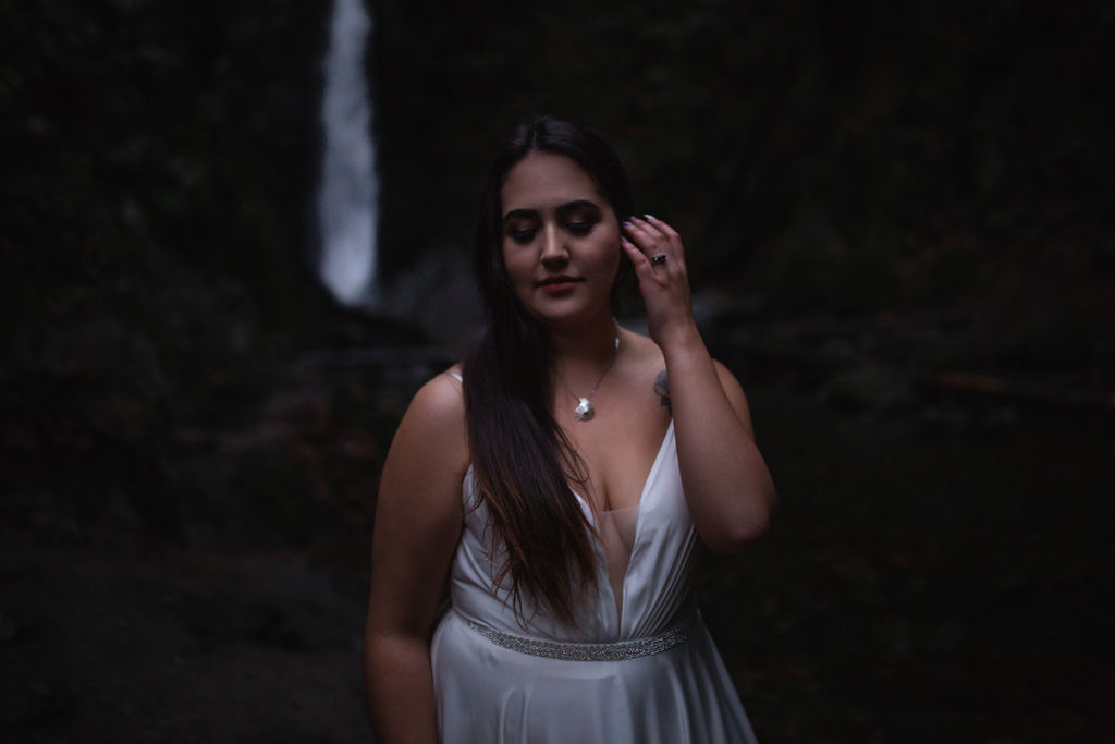 Waterfall bride pulls back hair in BC Wedding Magazine