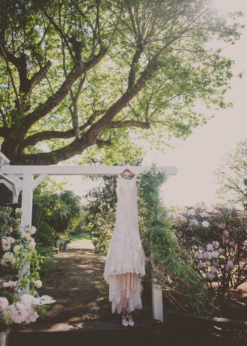 Bridal Gown hanging off garden gazebo at Maple Bay Manor West Coast Weddings Magazine