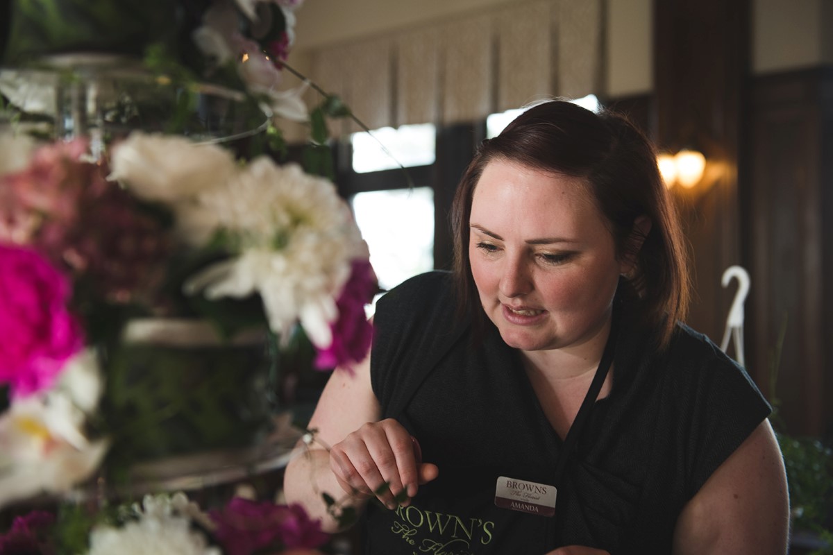 Brown's the Florist puts together floral cake of pink and white flowers at Fairmont Empress