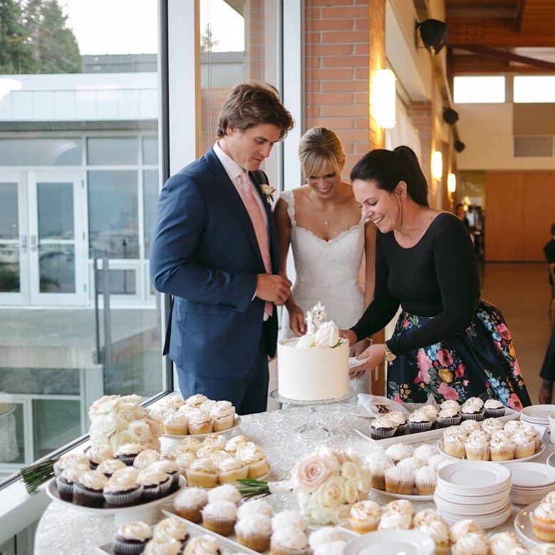 Choosing Wedding Professional Emma McCormack helps newlyweds cut cake