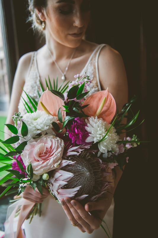 Tropical bridal bouquet with roses, orchids and palms by Brown's the Florist and KGoodPhoto