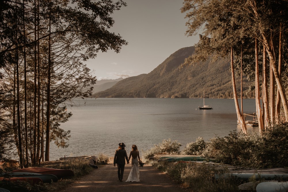 Golden Hour bride and groom walking to water boat in the water Sunshine Coast