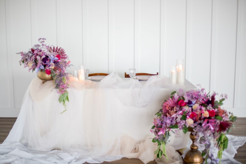 Wedding Head Table at The Wallace covered in white with pink and purple flowers