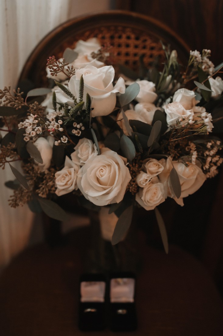 Bouquet of white roses and eucalyptus by Coastal Weddings and Events