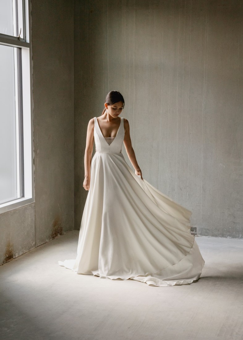 Aesling Crepe wedding dress with a subtle plunge, secured with silk organza.