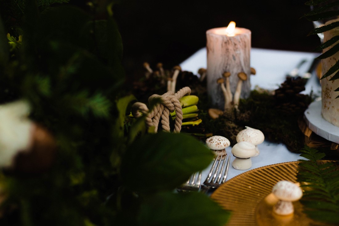 Birch candle with mushrooms and ferns on Vancouver Island wedding reception table