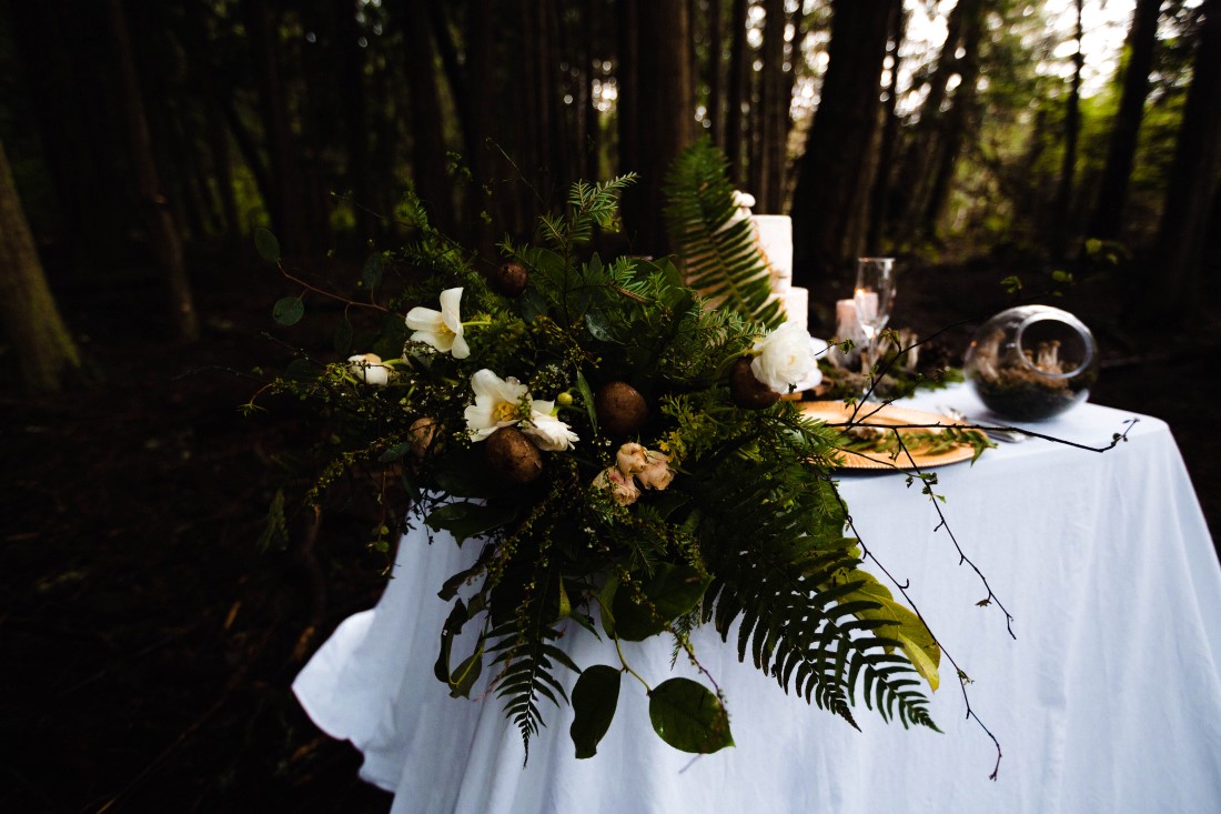 Forest Wedding Sweetheart Table featuring ferns and mushrooms