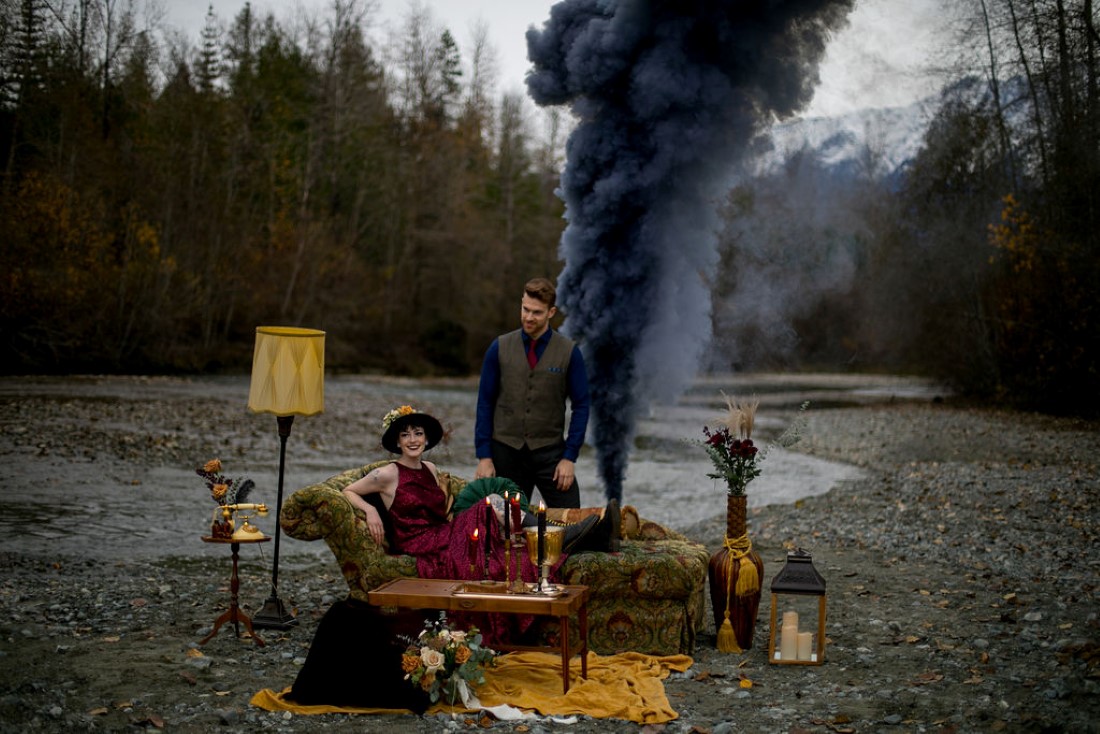 Road Trip Elopement couple lounge on furniture with smoke bomb