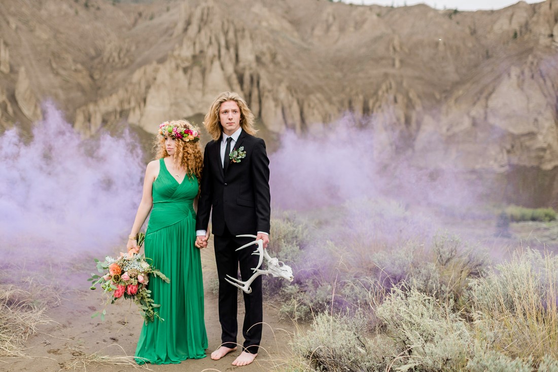 Desert Boho Inspired couple stand in smoke