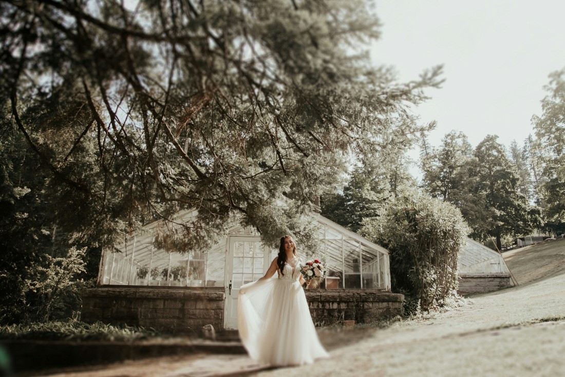 Bride walks down path towards ceremony