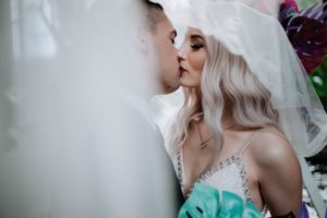 Elopement Giveaway newlyweds kiss at Parkside Hotel by Megan Maundrell Photography