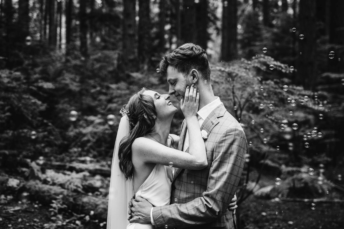 Black and White photo of newlyweds in the forest
