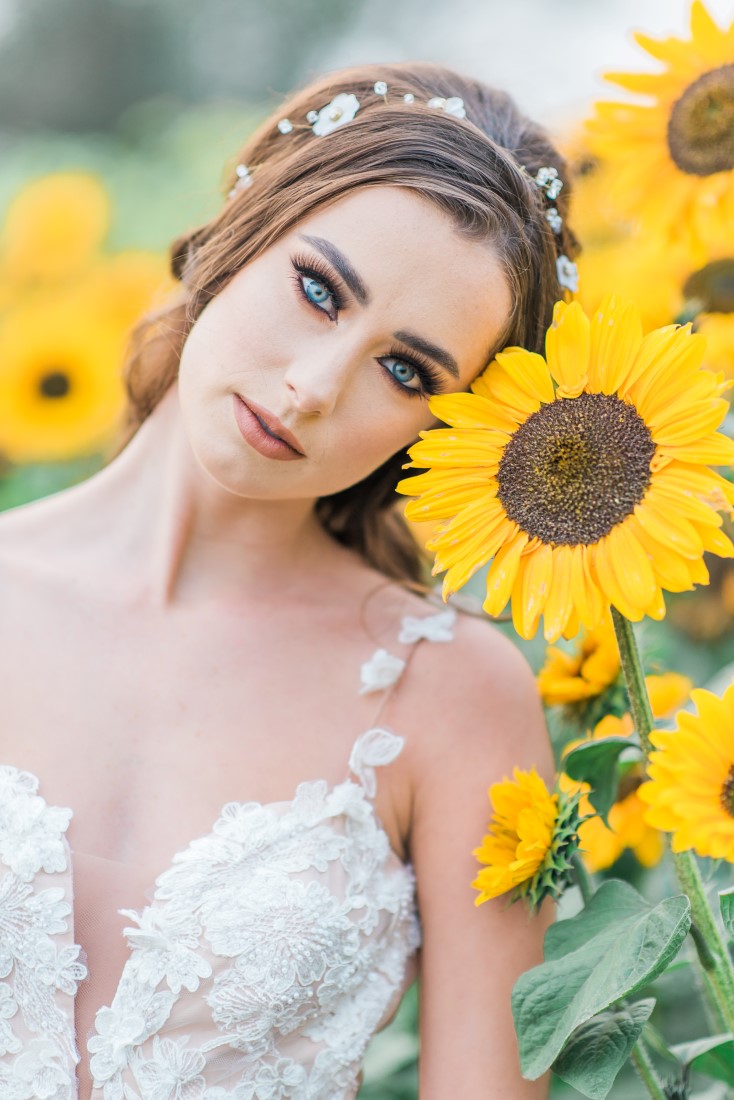 Sunflowers and Sunshine Wedding Inspo bride and sumflowers