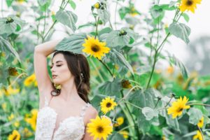 Sunflowers and Sunshine Wedding Inspo bride amongst sunflowers