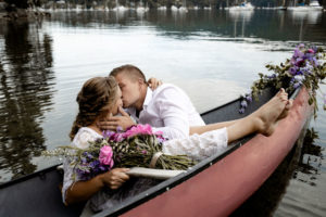 Adventure Elopement kisses in a canoe
