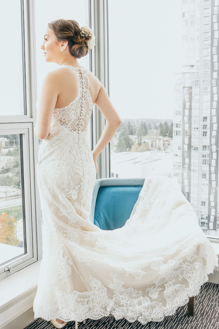Elka The Makeup Artist Photography Bride in window Bridal Grace and Style High Above Vancouver