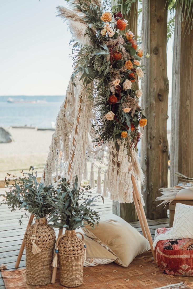 Crocheted boho teepee with roses on Vancouver beach