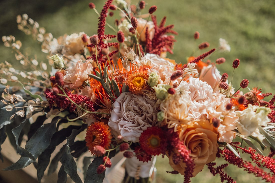 Bridal bouquet with burnt orange and cream roses