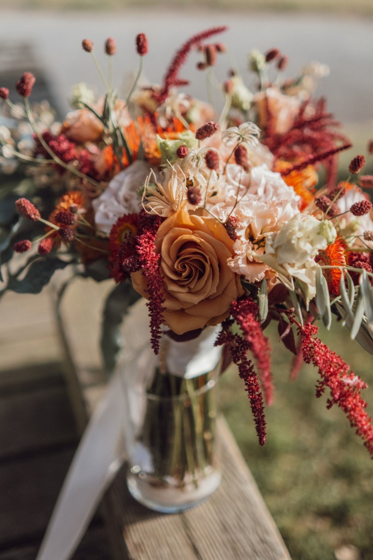 Bridesmaid bouquet with orange and white roses