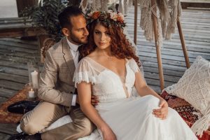 Bride in white gown with flounce sleeves by The Dressy Attic Vancouver