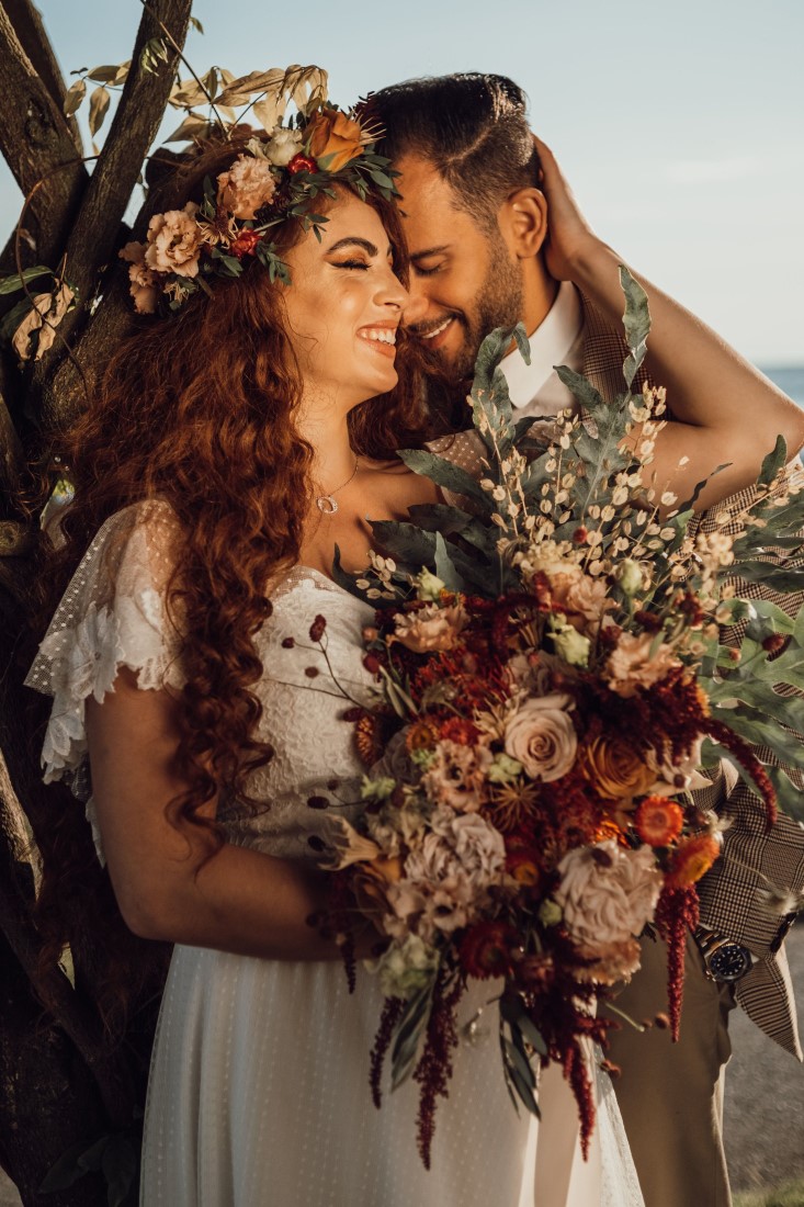 Bride holds large boho boquet by Celebrate Lavish Arrangements Vancouver