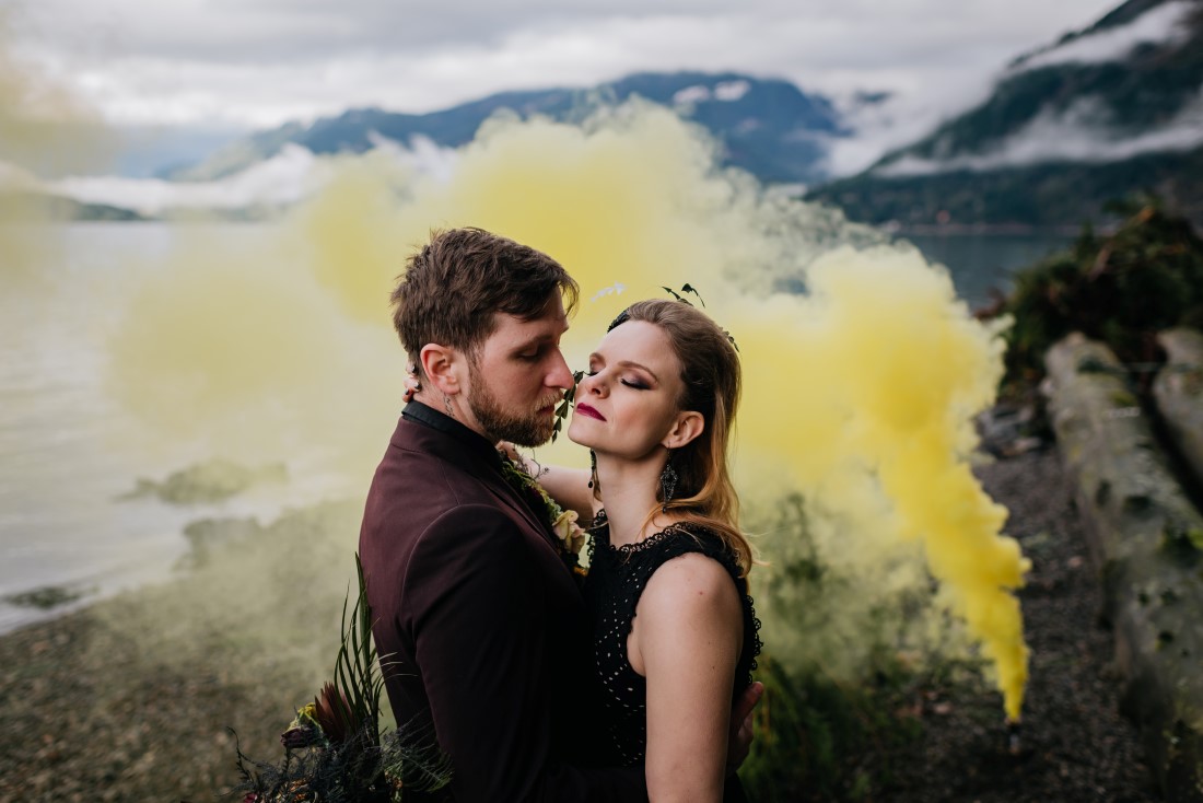 Unique newlyweds with yellow smokebomb by Leanne Sims