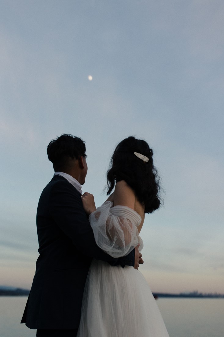 The Augusts Couple Looking at Moon Seaside in the City Vancouver Wedding Inspiration
