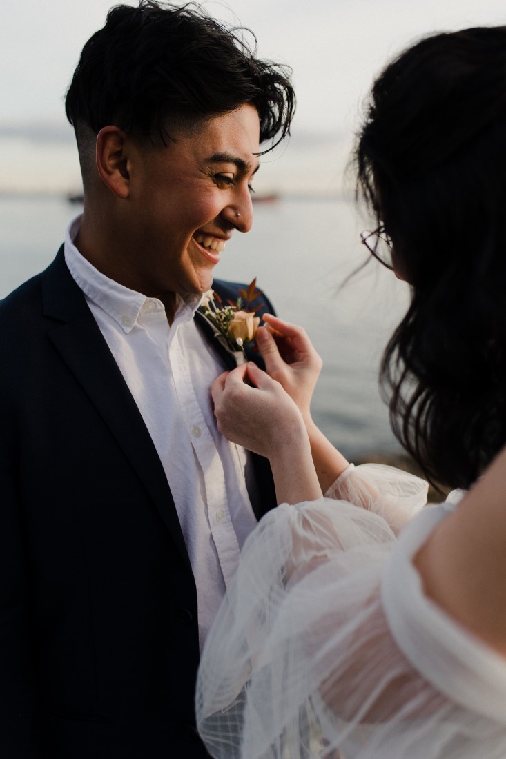 The Augusts Pinning Boutonniere Seaside in the City Vancouver Wedding Inspiration