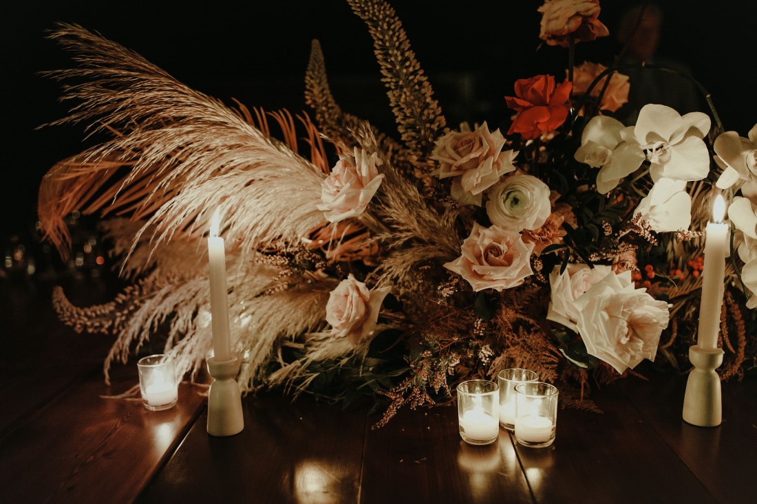 Vancouver Reception decor by DreamGroup Planners shows off roses and pampas grass with candles
