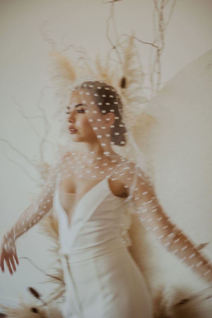 Bride in local Vancouver designer with polka dot veil