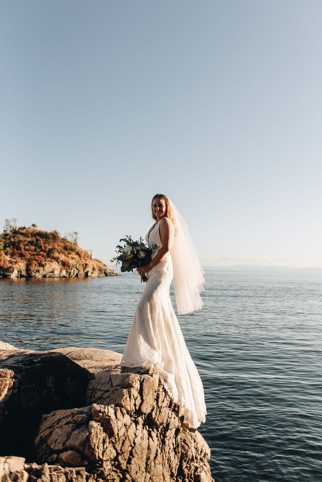 Bride stands on Keats Island Cliff by Li'i Photo