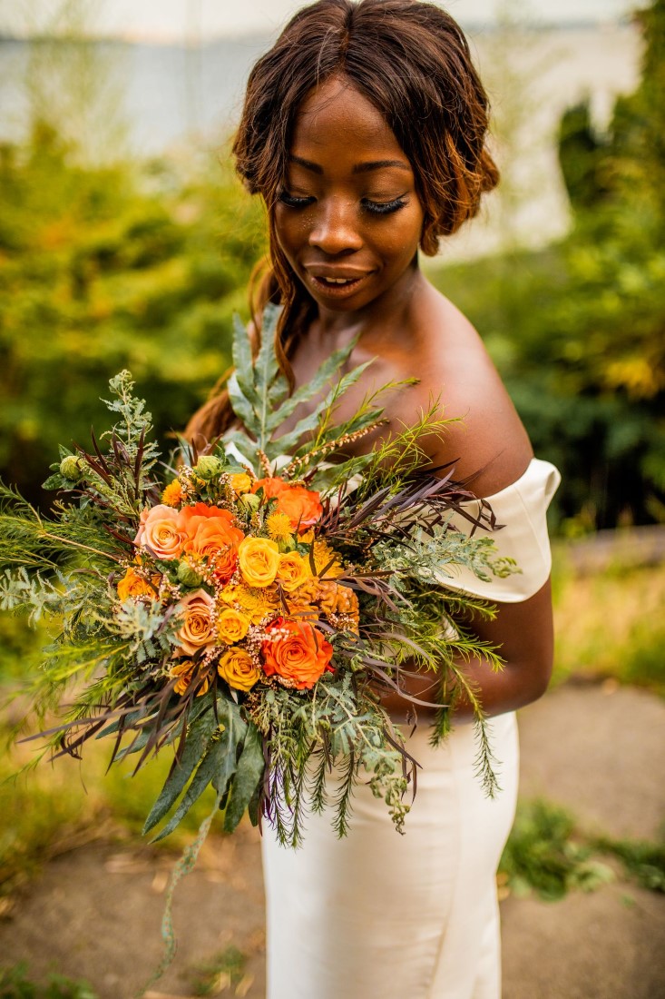 Bride shows off bouquet by Studio Full in Vancouver