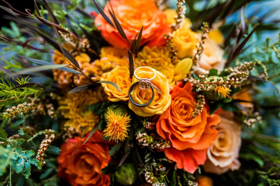 Bridal bouquet by Studio Full Bloomof yellow and orange roses with greenery