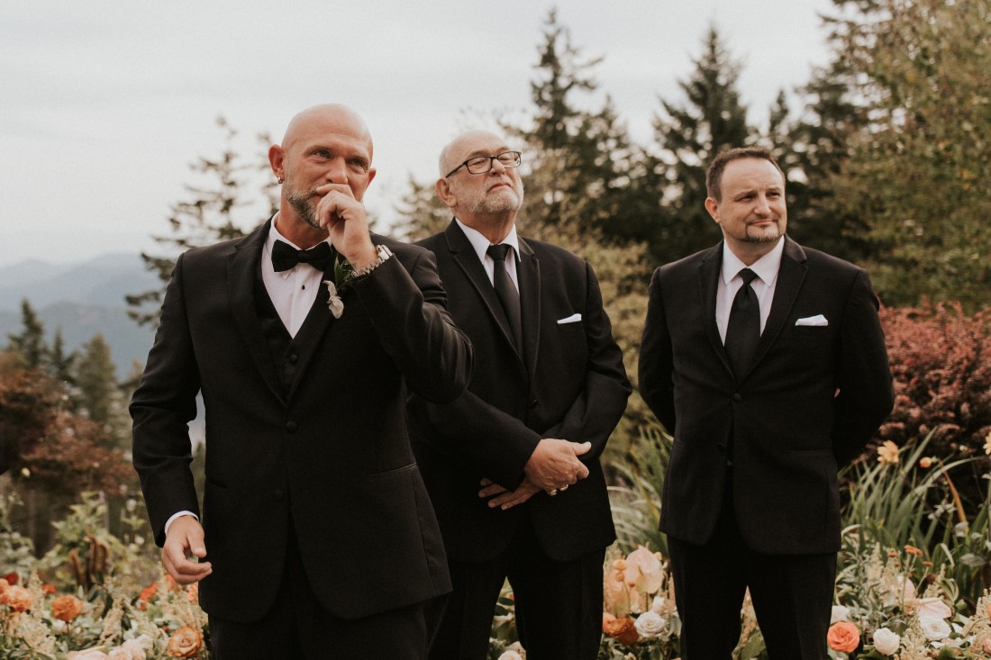 Dreamy Mountain Vows groom and groomsman see the bride