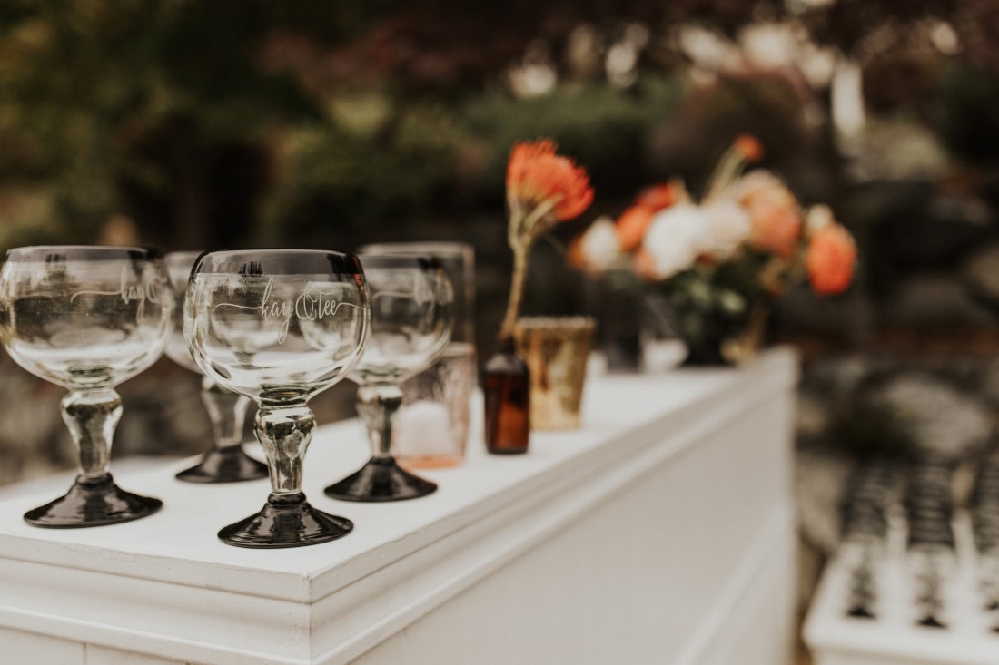 Glasses and flowers sit atop an outdoor bar at Villa Eyrie