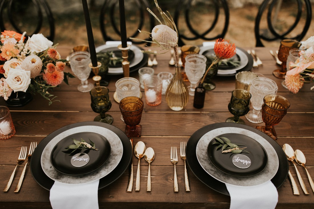 Dreamy Mountain Vows wedding table with black plates and candles 
