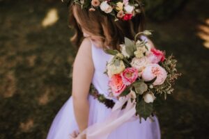 cutest flower girl hold pink and white rose bouquet by Foxglove Flowers