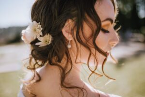 Bride with white flowers in her upswept hair