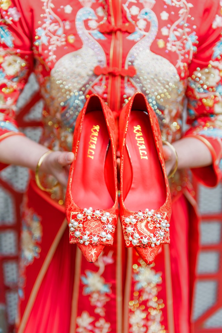 Chinese Bride carries red good luck shoes in Vancouver