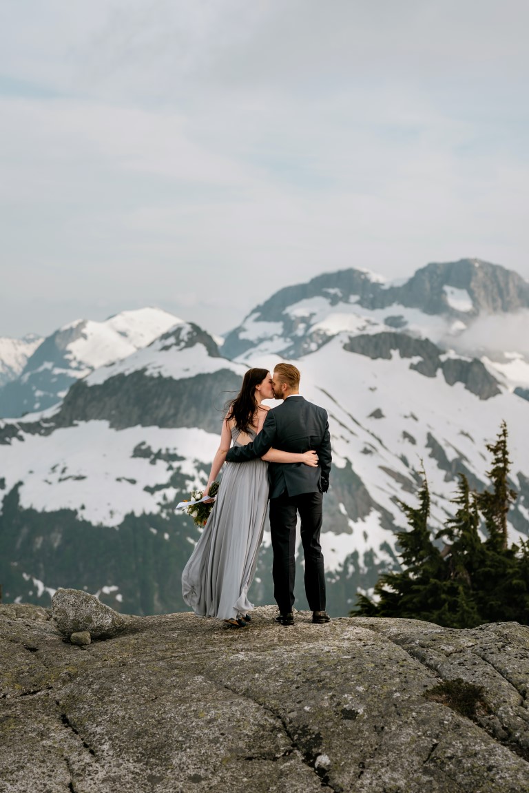 Bride and Groom look out towards BC Mountaintops