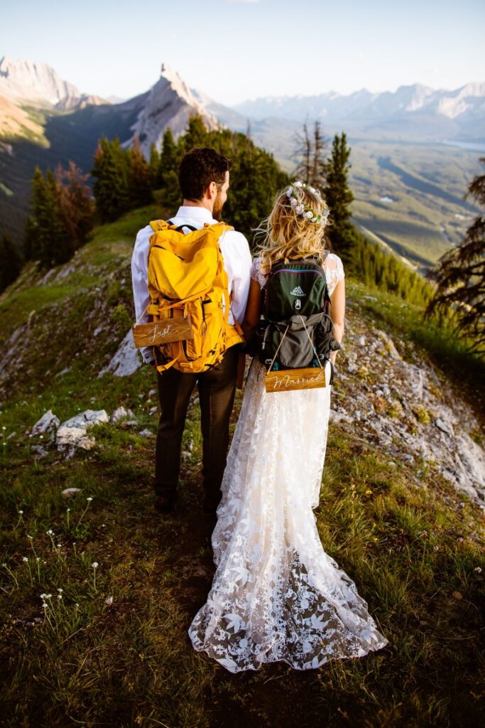Adventure wedding couple wear backpacks