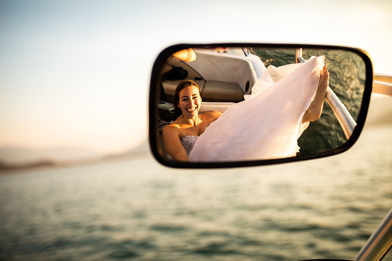 Surfer Bride Adventure in boat mirror by Esther Moerman