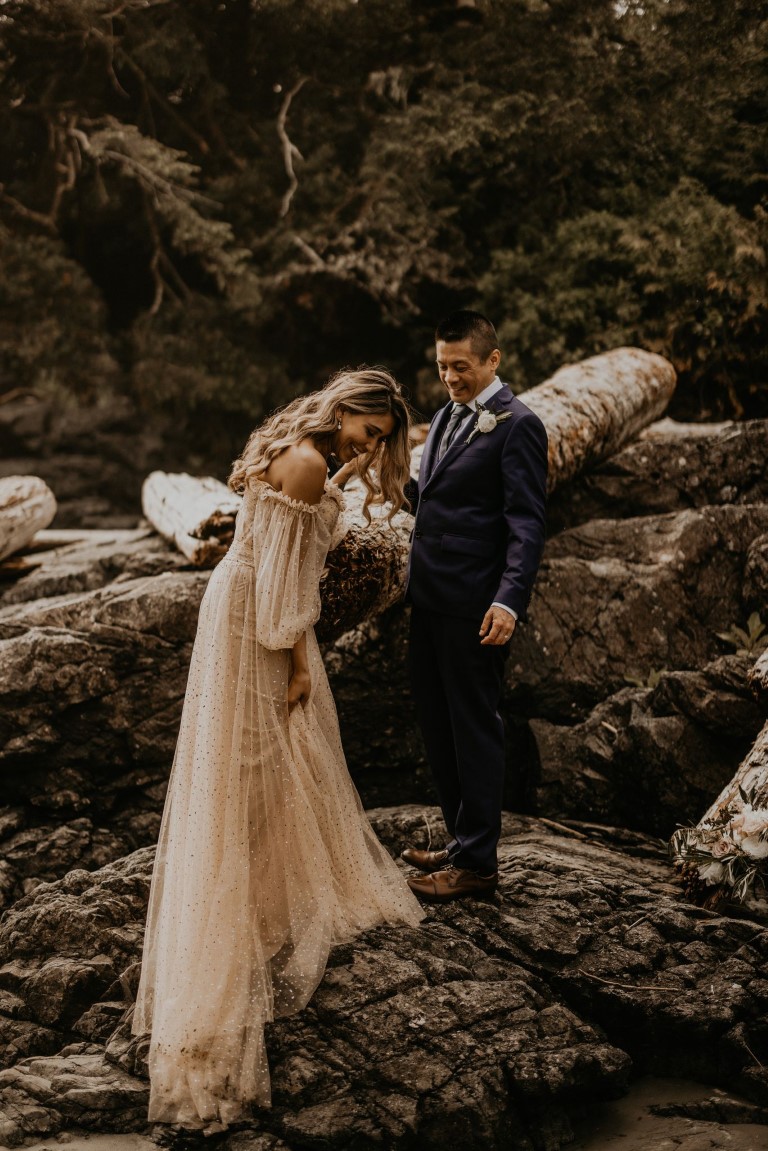Bride and Groom on Tofino beach with driftwood