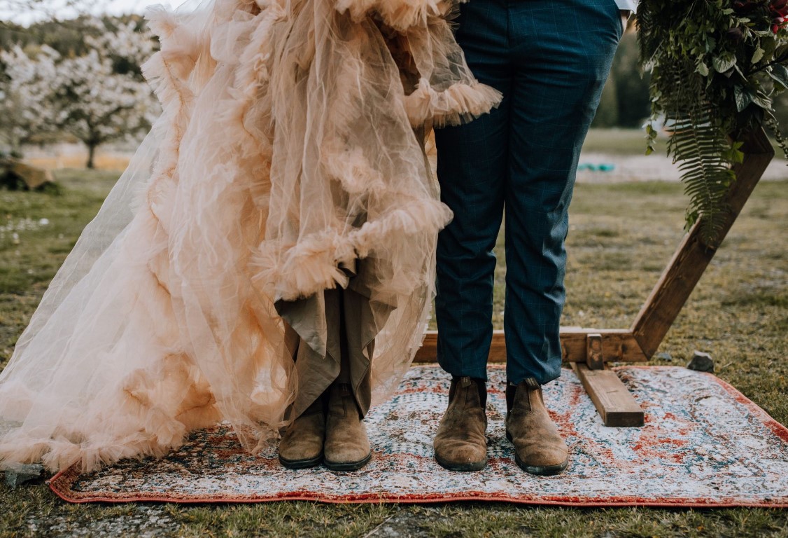 bride and groom in work boots by Elyse Anna Photography