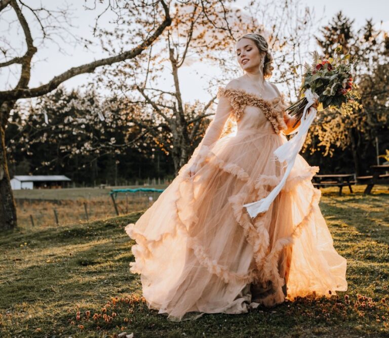 bride in peach wedding gown with ruffles by wild and cozy closet on Vancouver Island