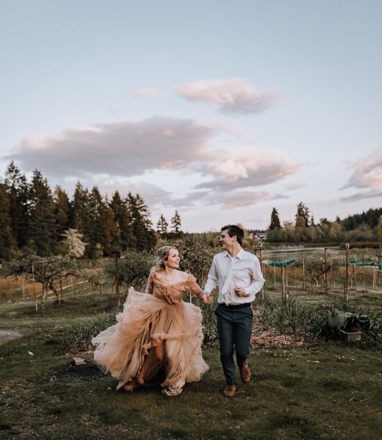 Eloping couple walk along farm lane in Nanaimo